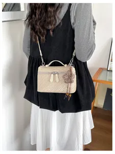 Retro woven texture crossbody lunch box bag, versatile commuter bag with flower charm.