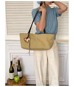 Casual canvas tote bag with shoulder strap and cute horse charm for daily commute and school use.