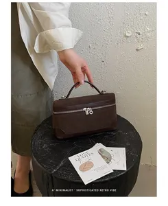 Detailed view of the brown retro suede vanity lunchbox bag with metal zip and handle.
