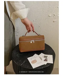 Retro suede lunch box bag for women, chic brown top-handle handbag, minimalist casual style.