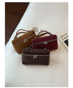 Detailed view of retro suede vanity handbags showcasing exquisite texture, elegant top handle and style.