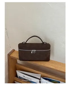 Retro brown suede vanity bag with top handle and metal padlock detail for daily wear.