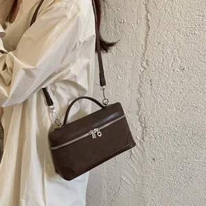 Vintage suede lunch box bag for women, chic crossbody shoulder bag with handle and zipper.
