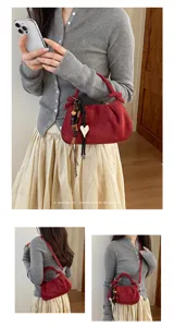 Korean style pleated red suede shoulder bag women versatile crossbody bag with chic heart charm.