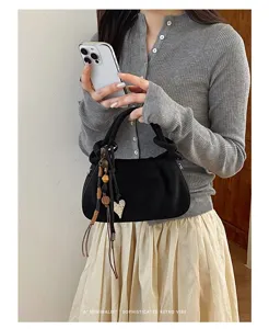 Korean style pleated handbag for women, chic black matte shoulder bag with beaded charm.