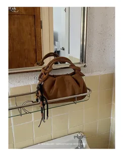Korean style pleated brown handbag for women, matte texture shoulder and crossbody bag detail view.
