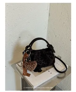 Retro leopard print cloud handbag with plush heart charm, stylish autumn winter crossbody bag.