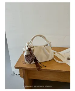 Retro ruched cloud handbag with leopard heart pendant, minimalist PU leather shoulder bag.
