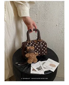 Brown polka dot Boston handbag with cute teddy bear charm, retro minimalist style daily purse.