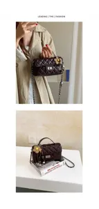 Quilted chain shoulder bag detail showcasing dark brown leather, metal twist lock and floral charm.