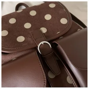 Stylish brown polka dot backpack for women, cute suede and leather daily school bag.