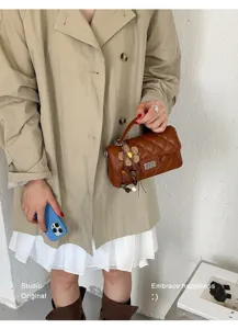 Brown quilted shoulder bag for women, chic PU leather small square handbag with charm.