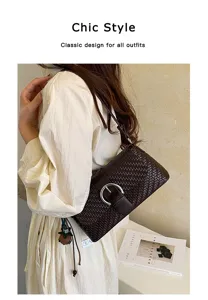 Detailed lifestyle shot of a chic dark brown woven leather shoulder bag with metal buckle.