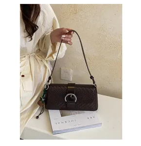 Chic brown woven baguette shoulder bag, premium leather texture, perfect for daily commuting.