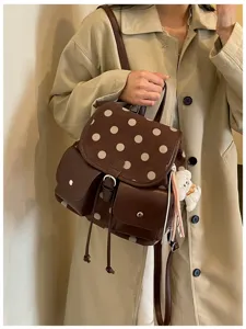 Korean style brown polka dot backpack detail, casual commuter school bag with cute bear charm.