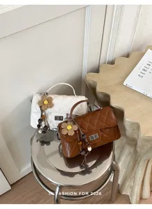 Stylish quilted chain shoulder bag for women, elegant daily small square bag with cute flower pendant.