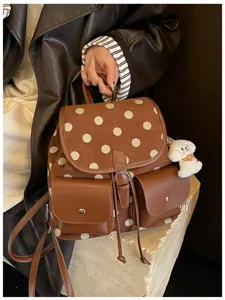 Chic Korean style polka dot backpack for women, stylish brown daily casual campus school bag.