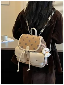 Korean style polka dot backpack with front pockets and cute dog pendant, daily casual design.
