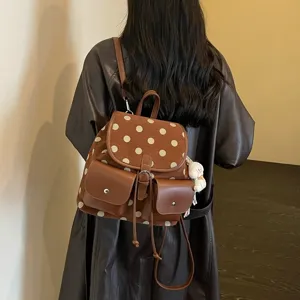 Korean style polka dot backpack for women, stylish brown suede school bag for daily commute.