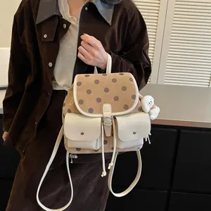Korean style polka dot small backpack women 2026 new chic retro commuter casual school bag