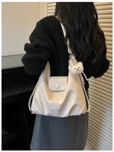 Borsa a tracolla e zaino retrò grande capacità per donna stile quotidiano dettaglio.