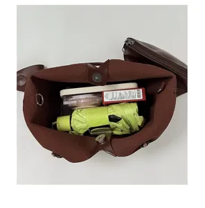 Detailed view of the brown large-capacity tote bag interior, showcasing spacious storage capacity.