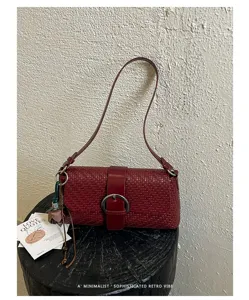 French retro woven leather underarm bag for women, chic casual minimalist single shoulder baguette bag.