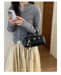 Black retro boston handbag for women stylish minimalist pillow shoulder bag commuter crossbody.