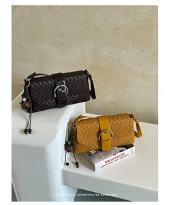 Detailed view of woven shoulder bag with chic metal buckle in minimalist retro aesthetic scene.