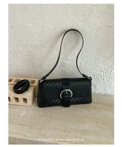 Classic black woven shoulder bag with chic metal buckle, stylish retro baguette bag for women.