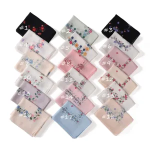 Detailed view of assorted floral print chiffon scarves, featuring various elegant color patterns.