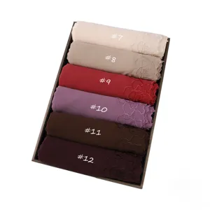 Elegant chiffon hijab scarf with delicate rose embroidery, solid color multi-pack boxed variant display.