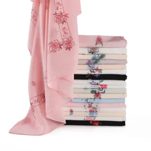 Detailed view of floral printed chiffon scarf, lightweight fabric, soft drape and vibrant colors.