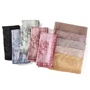 Detailed view of fashionable embroidered sequin fringe scarf shawl, elegant lightweight design.
