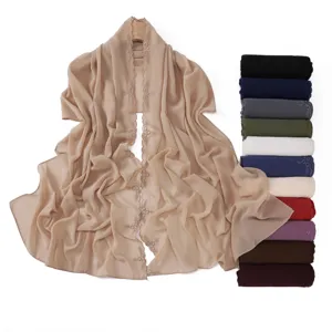 Detailed view of lightweight chiffon scarf with delicate floral embroidery trim and color options.