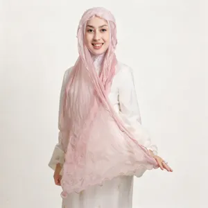 Detailed shot of lightweight crinkled chiffon hijab scarf, soft solid color with ruffled edge.