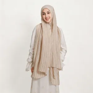 Detailed view of lightweight striped scarf with colorful sequins, soft texture, elegant drapery.