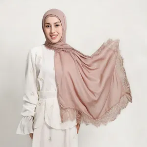 Detailed studio shot of modal long scarf featuring delicate lace trim and matching cap set.