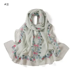 Detailed shot of the floral print chiffon long scarf in light green, spring accessory.