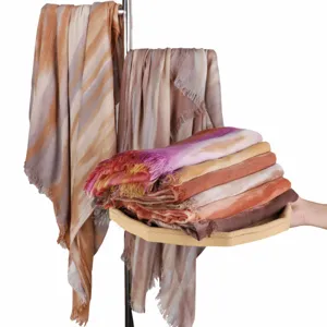 Gradient rayon crinkled scarf detail showing soft lightweight fabric, fringe tassels and draped texture.