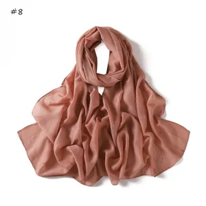 Detailed view of lightweight striped dotted women scarf fabric texture and metallic thread details.