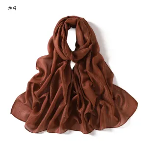 Detailed view of brown striped colorful silk scarf, lightweight, breathable, daily commute style.
