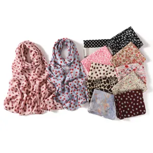Detailed view of lightweight chiffon scarves showcasing elegant floral and polka dot print patterns.