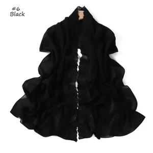 Black chiffon scarf detail showing elegant camellia embroidery and lightweight breathable fabric.