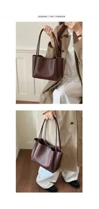 Close-up view of the dark brown woven leather tote bag showcasing detailed intrecciato texture.
