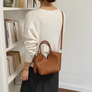 Women vintage woven leather handbag large capacity retro shoulder crossbody tote bag style.