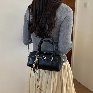 Black Boston handbag for women, stylish PU leather shoulder crossbody bag with buckle.