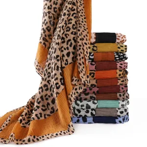 Colorful pleated leopard print scarf detail, soft breathable fabric with elegant draped texture.