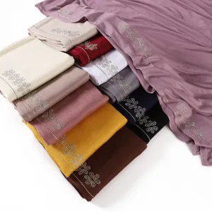 Solid color mercerized cotton jersey hijab scarf with rhinestone flowers, soft, breathable.