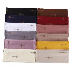 Solid color shimmering cotton hijab with gold rhinestone details, multi-color display.